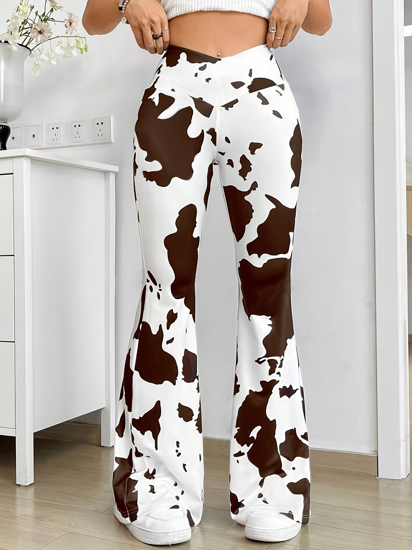 Naida - Hoog uitgesneden broek met koeienprint