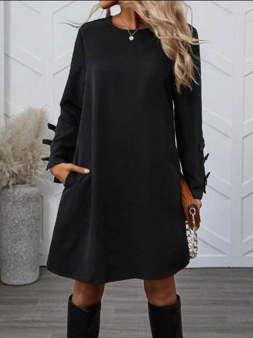 Dames zwarte a-lijn jurk – mini met elegante strikdetails