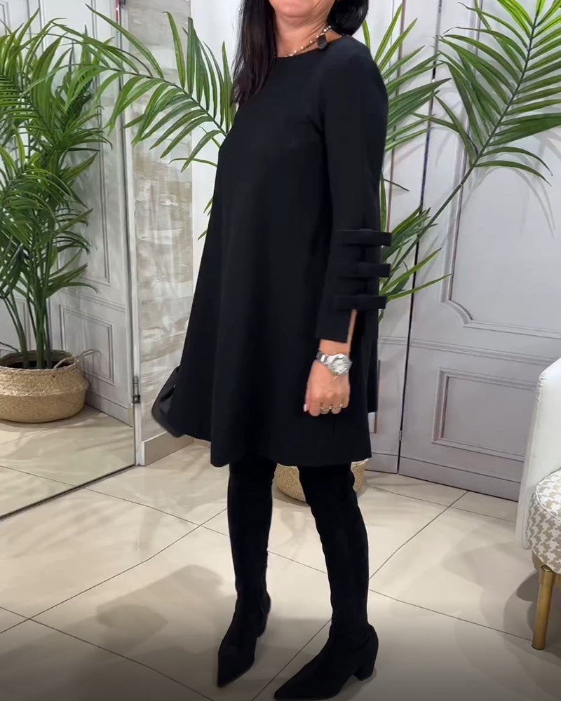 Dames zwarte a-lijn jurk – mini met elegante strikdetails