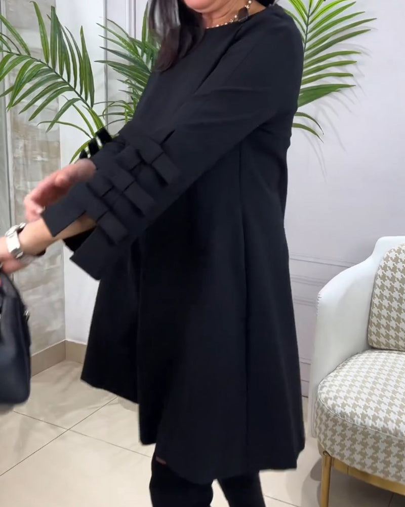 Dames zwarte a-lijn jurk – mini met elegante strikdetails