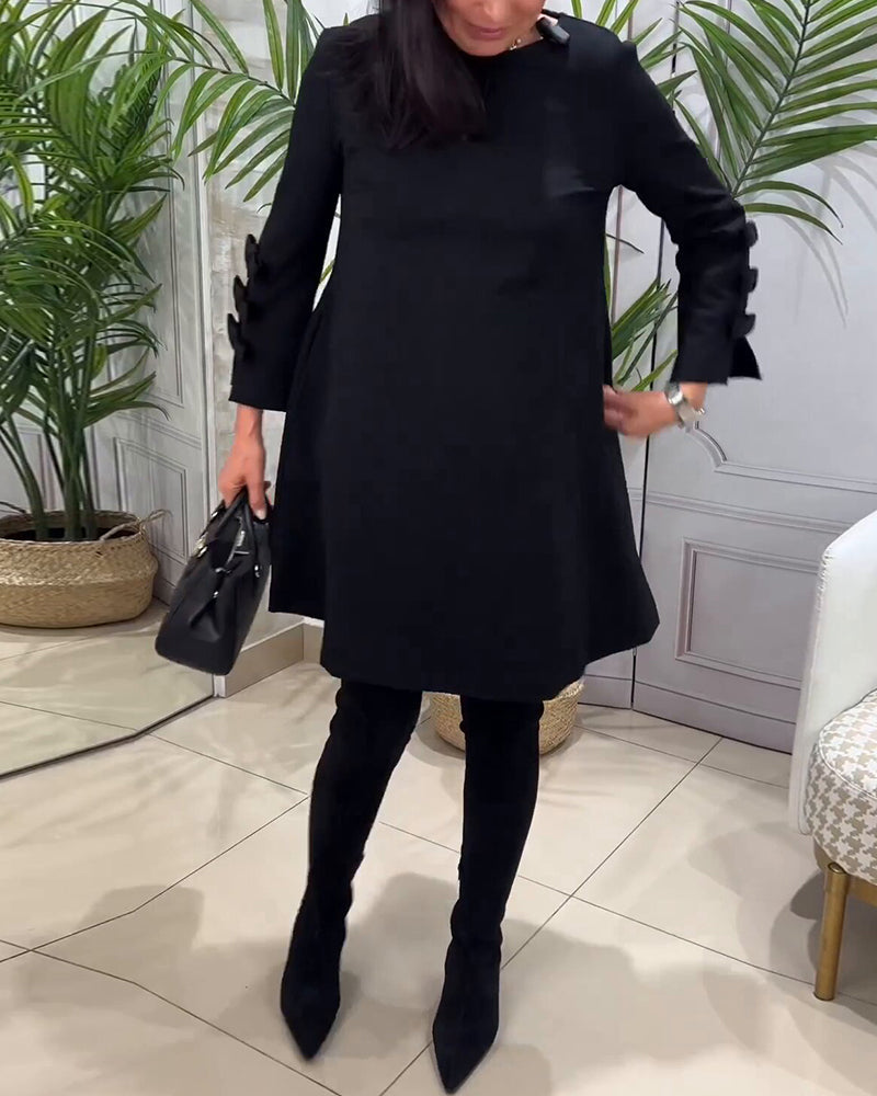 Dames zwarte a-lijn jurk – mini met elegante strikdetails