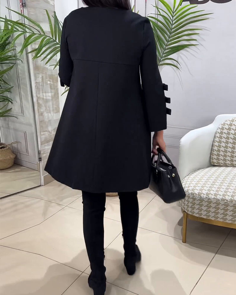 Dames zwarte a-lijn jurk – mini met elegante strikdetails