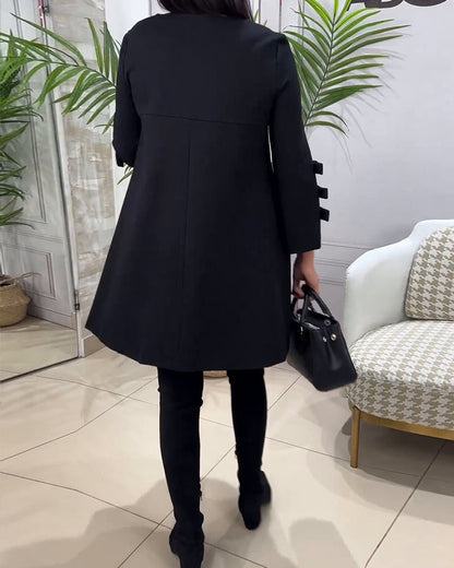 Dames zwarte a-lijn jurk – mini met elegante strikdetails