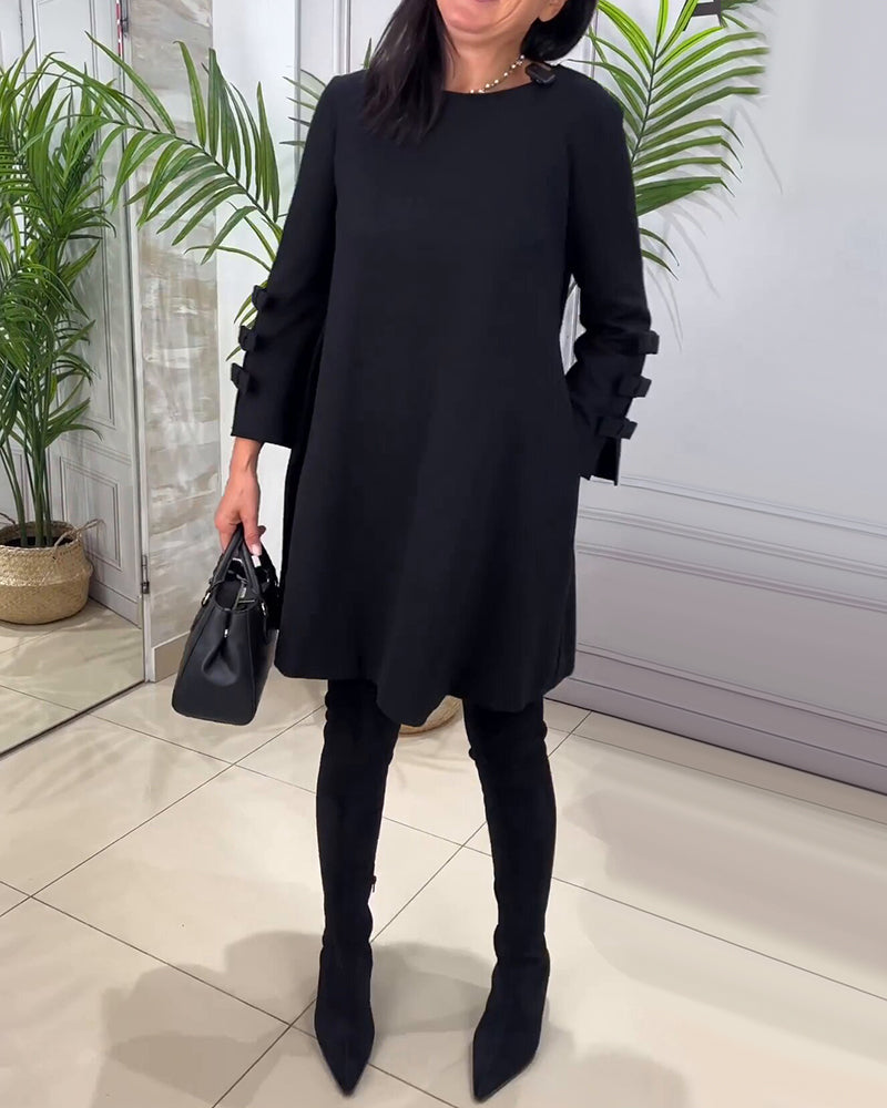Dames zwarte a-lijn jurk – mini met elegante strikdetails